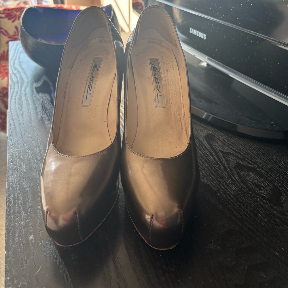Unique bronze colored Brian Atwood platform pumps. Size 9..